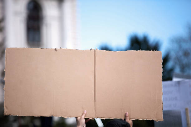 istock Protesters holding placards and signs on the streets. 1363784977