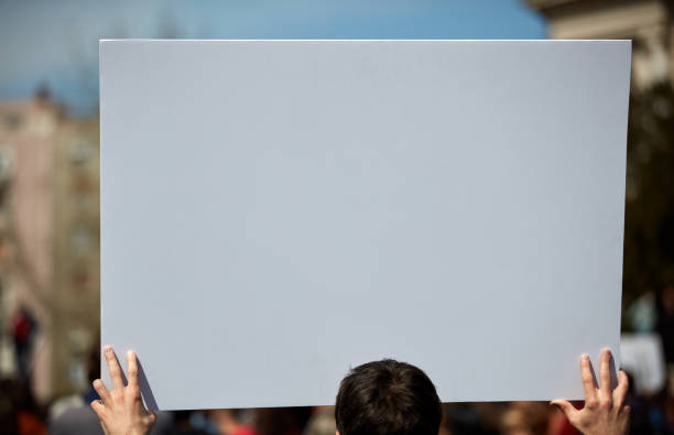 istock Protesters holding placards and signs on the streets. 1363784999