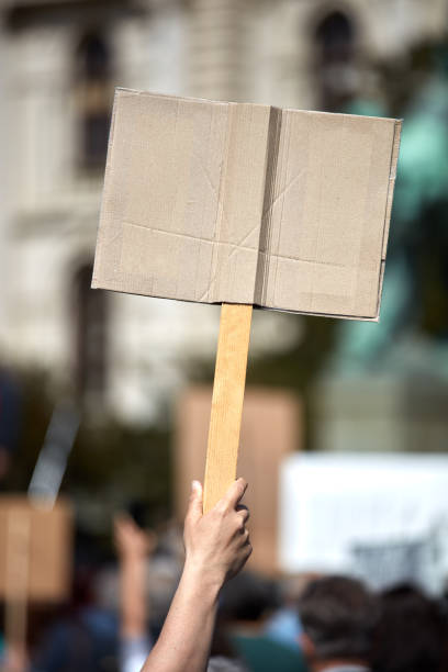 istock Protesters holding placards and signs on the streets. 1363785023