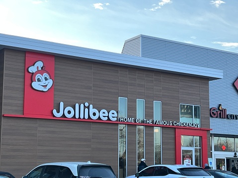 Exterior of Jollibee Restaurant located in a shopping center on the north side of Chicago. Jollibee is a Filipino multinational chain of fast food restaurants