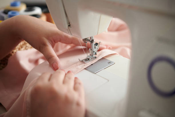istock Seamstress Sewing Silk Dress 1363794799