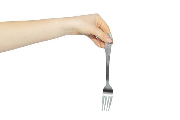 istock fork in hand on white background, concept to pass or throw away 1363795147