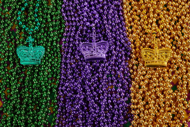 istock Green, gold, and purple Mardi Gras beads background 1363796501