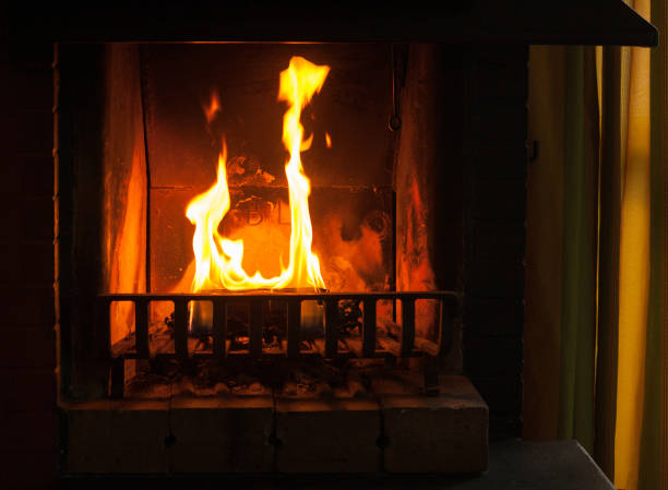 istock a piece of wood burning in a fireplace 1363796675