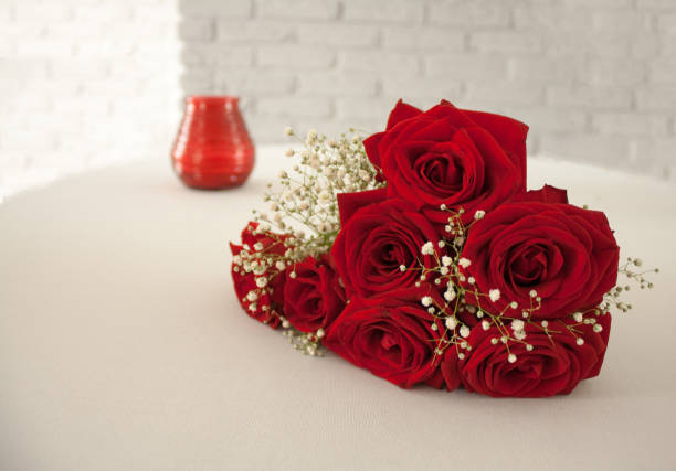 istock wedding bouquet with red roses on a table 1363797630