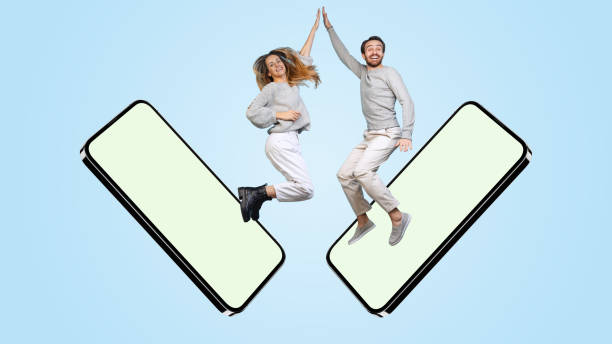 colage of joyful man and woman jumping out phone screen isolated over blue background - fashion colage imagens e fotografias de stock