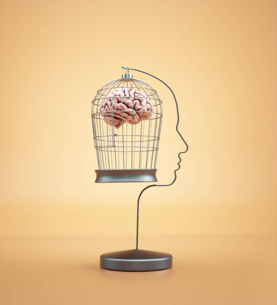 istock Bird cage in shape of a human head with a brain inside. 1363798153
