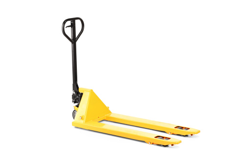 A studio shot of an empty fork pallet truck stacker isolated against white background
