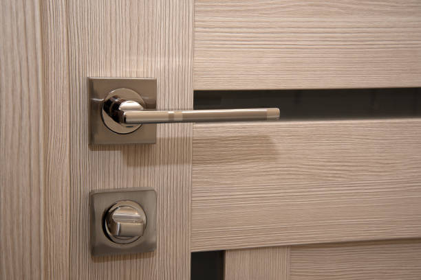 istock A modern, shiny door handle on a light-colored new interior door 1363801591