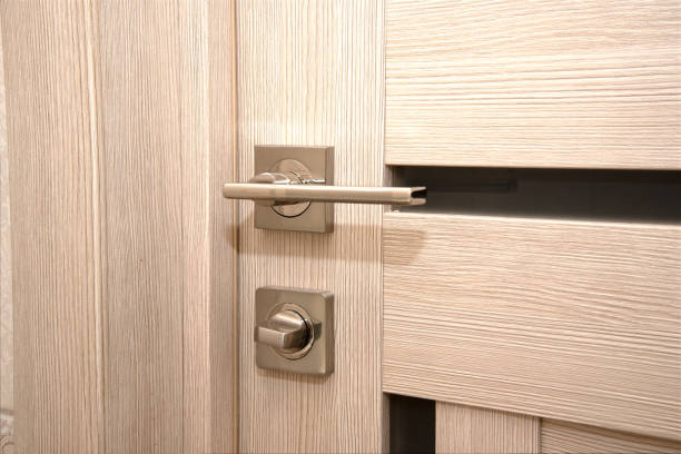istock A modern, shiny door handle on a light-colored new interior door 1363801669