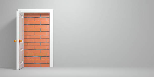 istock No escape and entrance. Doors laid bricks 136380256