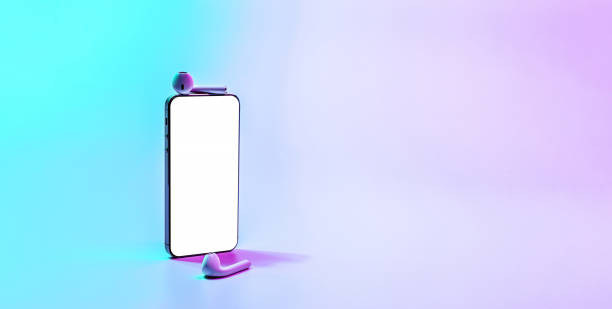 istock Screen mockup. Mobile smartphone technology blank screen. Mock up smart phone device, audio headphones on neon gradient banner. Game design, mobile application presentation or portfolio mockups. 1363804262