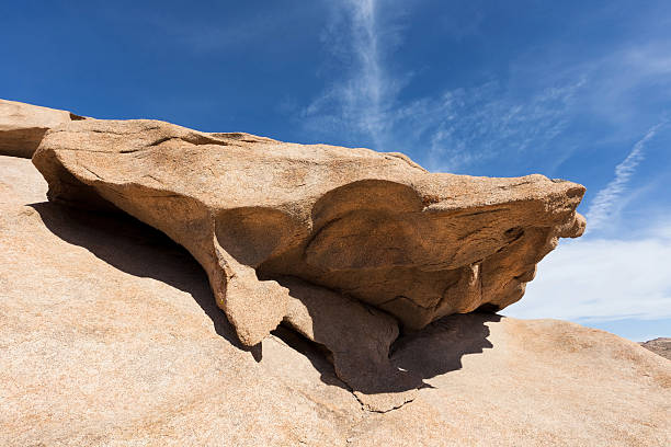 istock Sunlight illuminates the granite labyrinth of rock surface 136380624