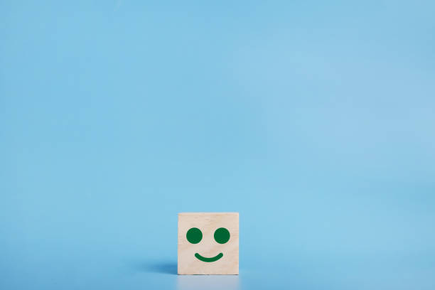 istock Smiley face icon on the wood cube, Customer service rating, survey concept. 1363806363