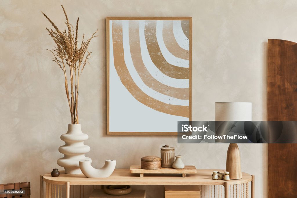 Stylish living room interior design with console and mock up poster frame. Lamp, vase and elegant personal accessories. Copy space. Template."n Living Room Stock Photo