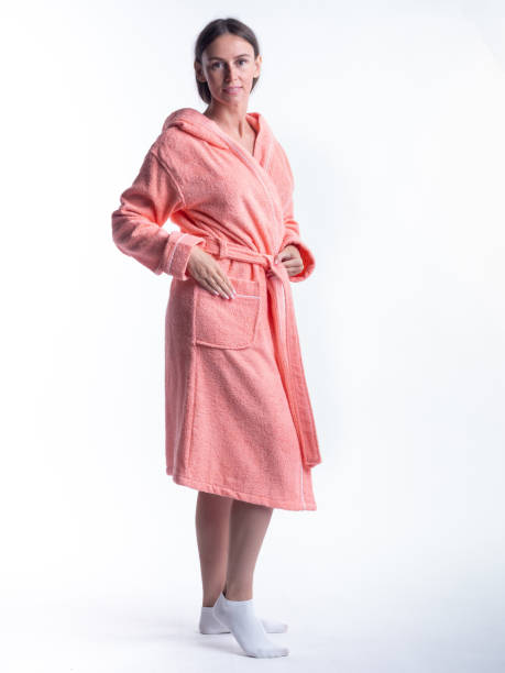 istock woman in a Bathrobe on an isolated white background with a smile on her face. 1363806466
