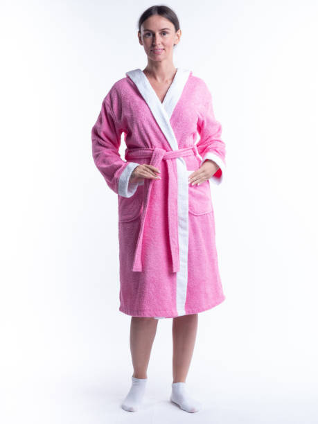 istock woman in a Bathrobe on an isolated white background with a smile on her face. 1363806472