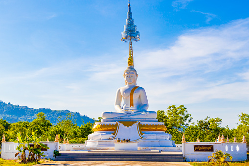 Giant white golden Big Buddha statue in Wat Phadung Tham Phothi temple in Khao Lak Phang-nga Thailand.