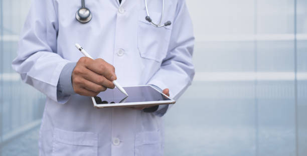 istock Doctor using digital tablet in hospital 1363806835