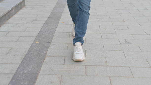 istock Serious Man Walking on the Street 1363807539