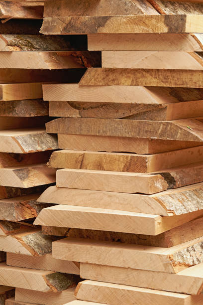 Vertical photo of a large pallet of rough wood planks. stock photo