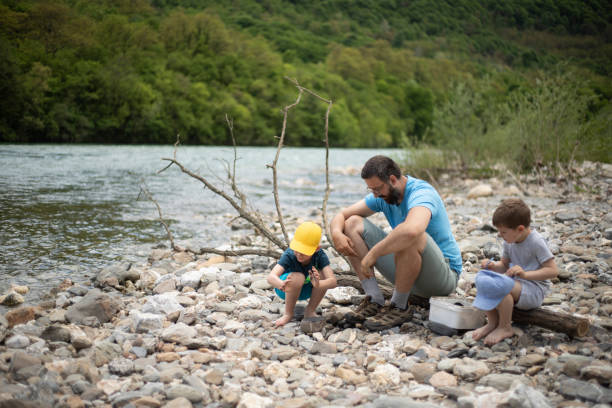 istock Father teaching his boys about the environment 1363814814