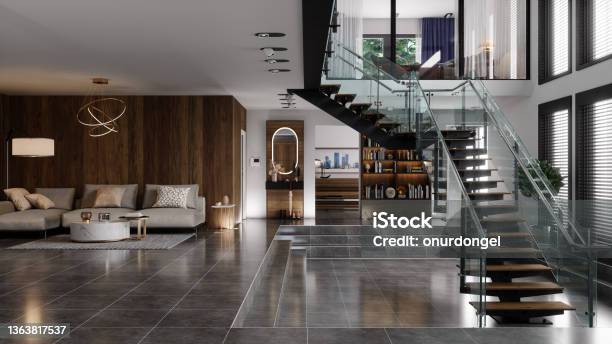 Luxury Modern House Interior With Corner Sofa Bookshelf And Staircase Stock Photo - Download Image Now