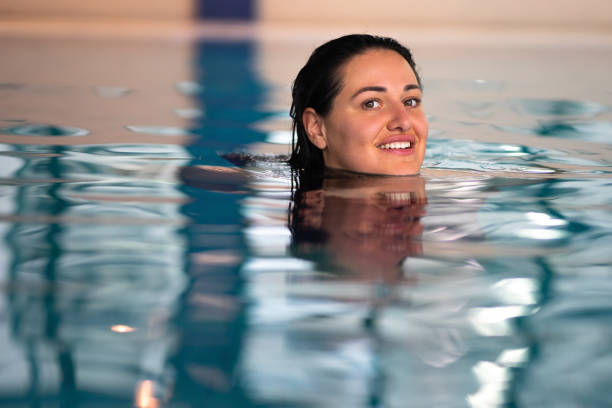 istock Plus size woman at the swimming pool 1363817548