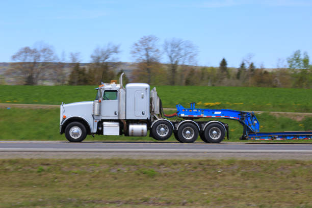 istock Semi-truck and flat bed trailer 1363818019
