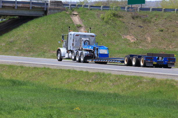 istock Semi-truck and flat bed trailer 1363818672