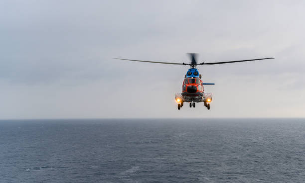 istock The civil helicopter over the sea 1363820183