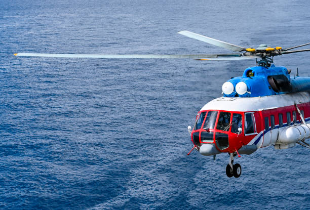 istock The civil helicopter over the sea 1363820192