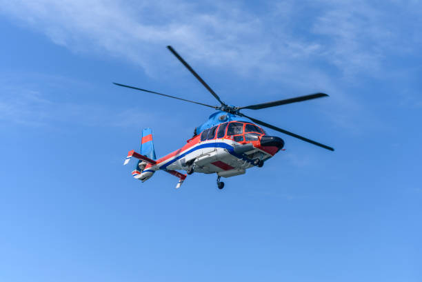 istock The civil helicopter over the sea 1363820202