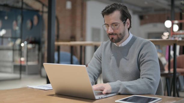 istock Young Man Working on Laptop in Office 1363820214