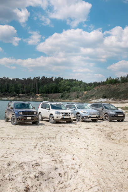istock group of suv cars at sandy beach 1363822713