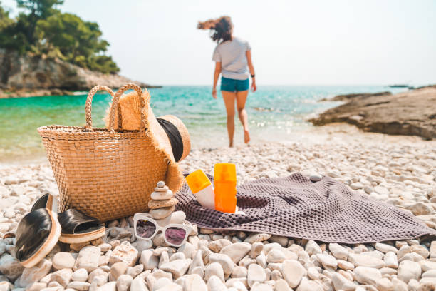 istock beach stuff straw hat and bag with flippers and sun protection cream 1363822734