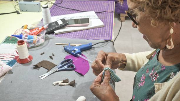 istock Artisan lady handcrafting a cloth doll 1363831921