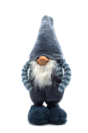 Closeup of blue christmas gnome standing on white background