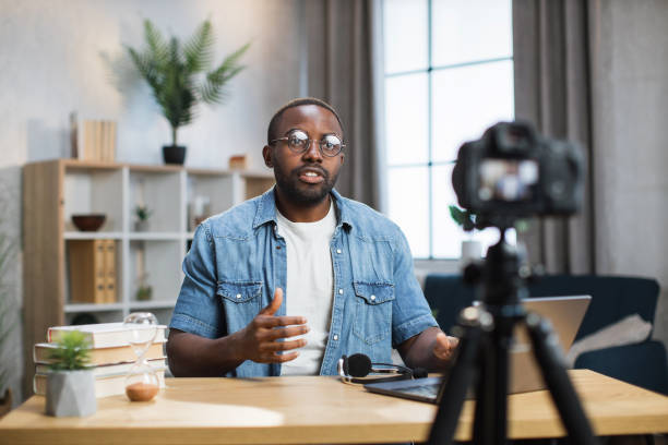 istock African american man doing live stream at home 1363832309