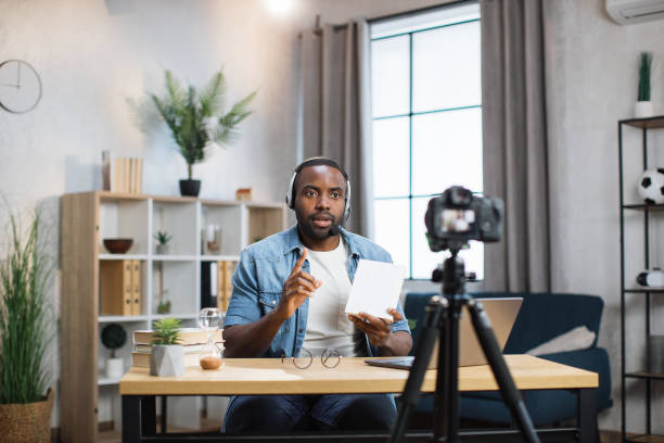 istock African man in headset recording online lesson at home 1363832414