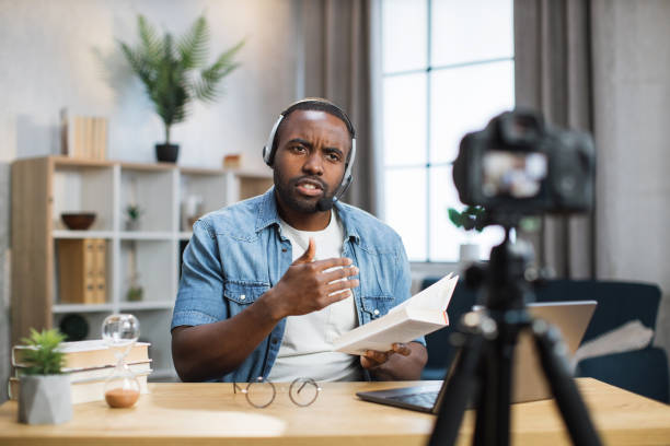 istock African american man doing live stream at home 1363832434