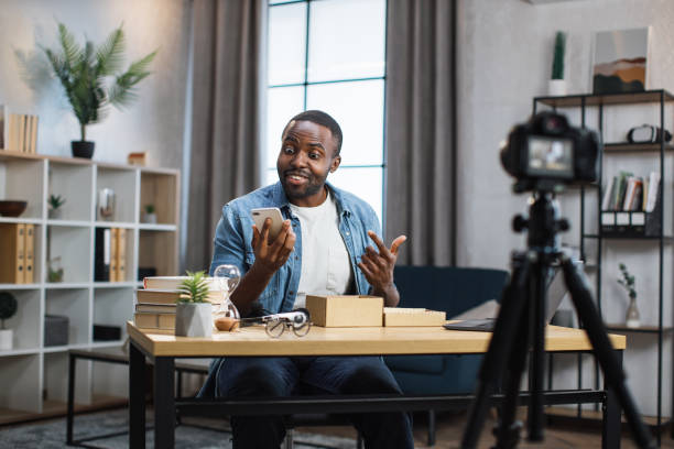 istock African man filming video while unpacking new smartphone 1363833182