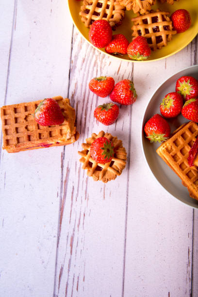 istock Viennese waffle muffins with strawberries and jam on a plate, top view, copy space 1363833269