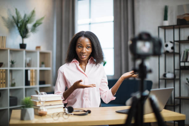 istock African woman using camera for live stream at home 1363833453
