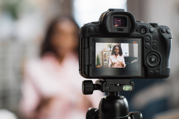 istock Female influencer filming video while sitting at home 1363833511