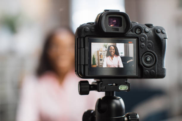 istock African woman using video camera for live stream 1363833579