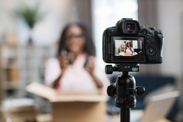 istock African female blogger doing live stream while unpacking box 1363833717