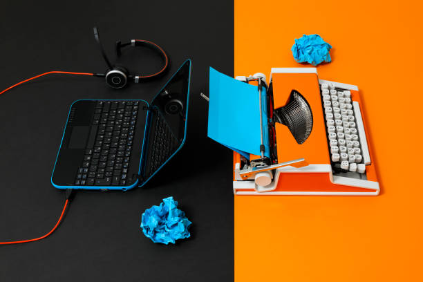 istock Digital and analog – Laptop and 70s Typewriter 1363833744