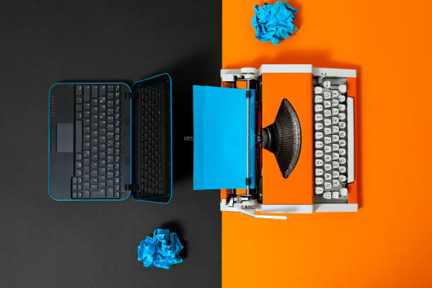 istock Digital and analog – Laptop and 70s Typewriter 1363833767