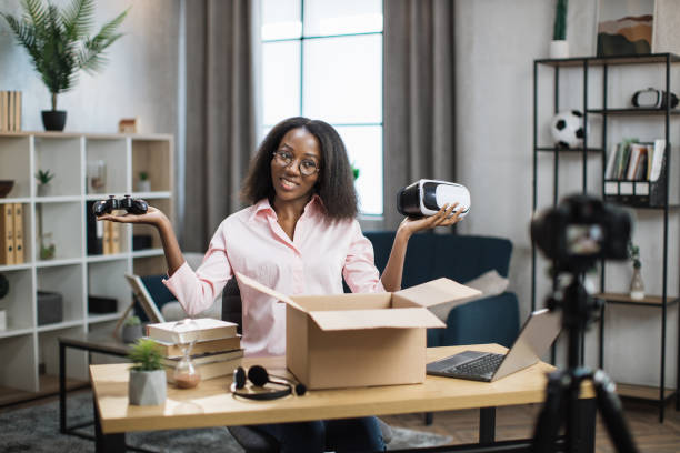 istock African blogger recording video while opening box 1363833769